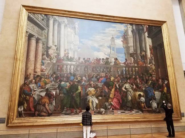 Ez a kép közvetlenül a Mona Lisa-val szemben található a Louvre-ban. Bár kevésbé ismert, legalább olyan érdekes.